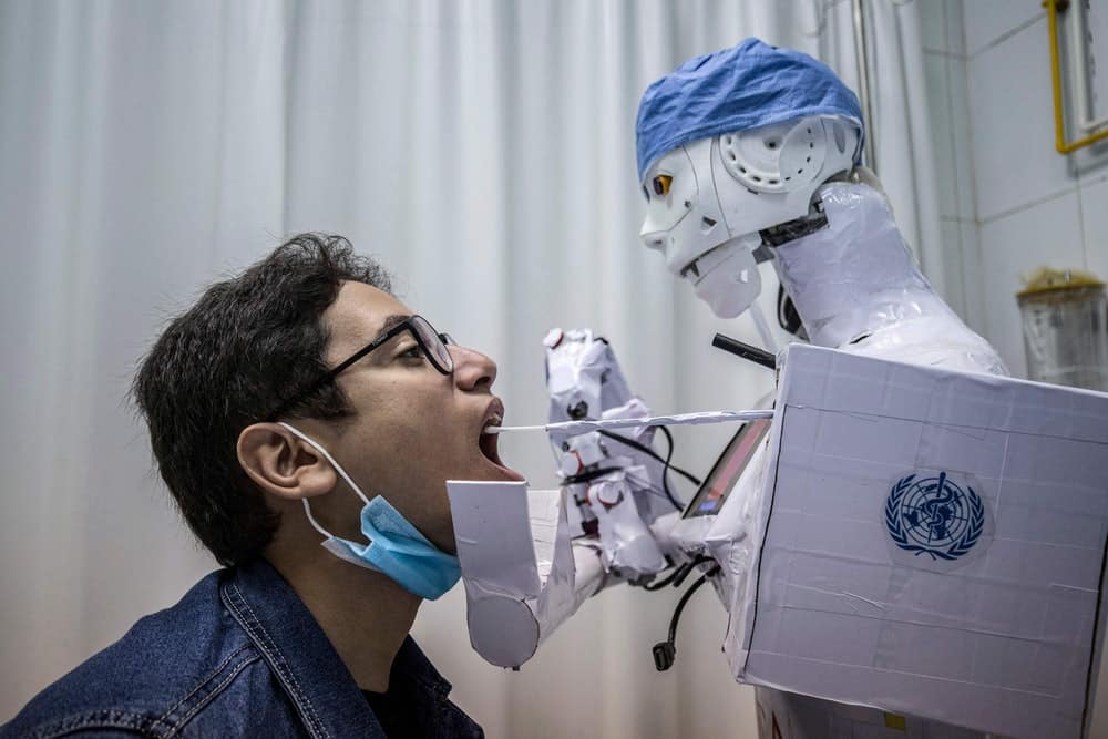 robot-covid-swab A robot collects a throat swab sample at a private hospital in Egypt. (Credit: KHALED DESOUKI/AFP via Getty Images)