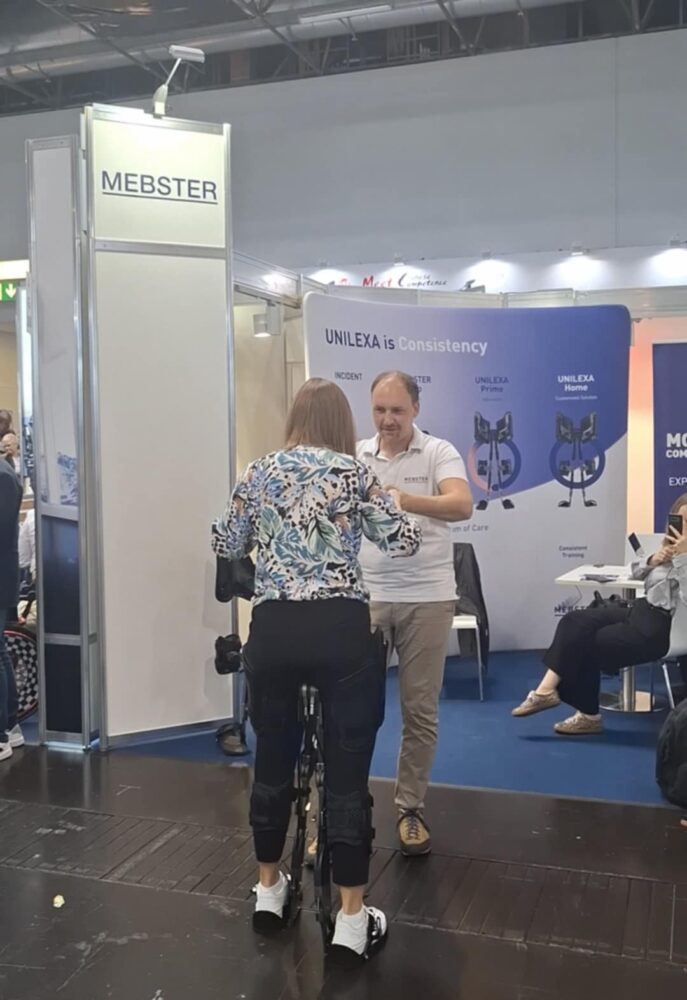 mebster-woman-tests-product-687x1000-1 Woman tests UNILEXA. Mebster stand at RehaCare 2025. Image: MedicalExpo e-Magazine.