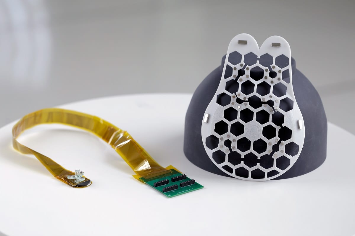 Using magnets, the flexible, 3D-printed patch can be attached to a bra that has openings to allow the ultrasound scanner to contact the skin. (Credit: MIT)